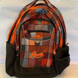 ROOTS backpack. NEW, never used. Key holder intact. Orange with plaid accents.